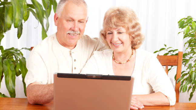 elderly couple having a consultation online