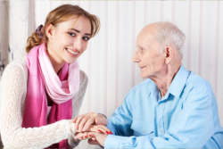 caregiver caring for the elder man