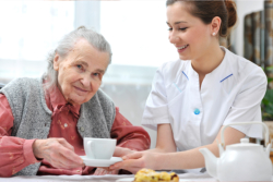 caregiver taking care of the elder woman